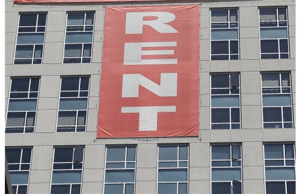 In a recent bulletin, the two report Canadian Mortgage and Housing Corporation numbers that demonstrate it’s 32.5-per-cent cheaper to rent rather than own a one-bedroom unit in Vancouver. Photograph by: Justin Sullivan, Getty Images