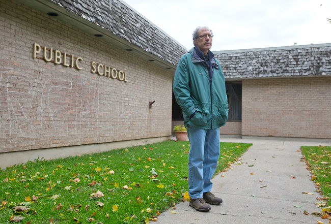 Sandy Levin stands outside of the former Sherwood Forest public school Sunday. Levin is head of the Orchard park Sherwood Forest ratepayers group. (CRAIG GLOVER, The London Free Press)