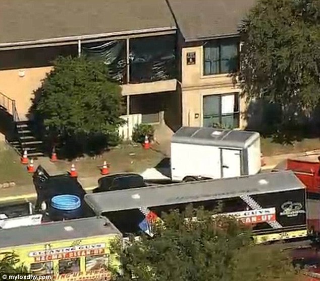 The apartment entrance was covered with black plastic today as the cleaning got underway at the Dallas home following criticism over the Texas authorities delayed response to the health crisis