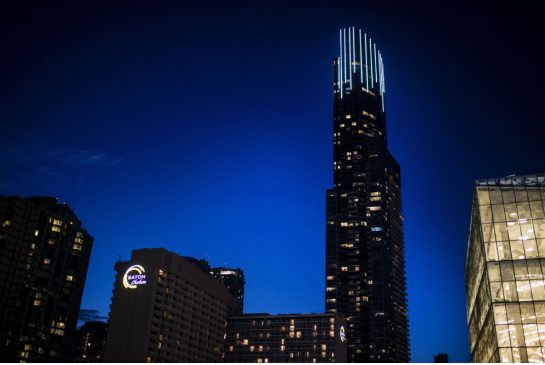 BRIAN B. BETTENCOURT / TORONTO STAR A view of the Aura Condo building in downtown Toronto on the evening of August 11, 2015. The building features a unique light installation that shines throughout the evening.