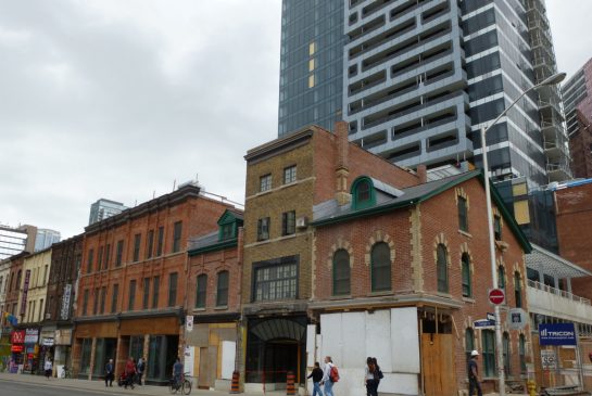 SUSAN PIGG/ TORONTO STAR Yonge and St. Joseph St., where MOD Developers has opted to build its condo towers atop a historic warehouse just behind a historic block of Yonge st. and have specialized heritage architects meticulously restore/build the stores in front of the condo tower.