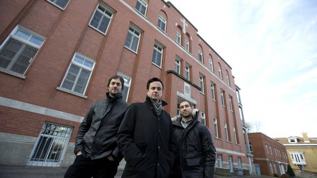 Partners Florent Moser (L), Ali Lakhdari (C) and David Lafrance of Demonfort, a development and construction firm, stand outside les Soeurs missionnaires de l’Immaculé-Conception, the convent they plan to convert to condos in Montreal, December 8, 2015. (Christinne Muschi for The Globe and Mail)