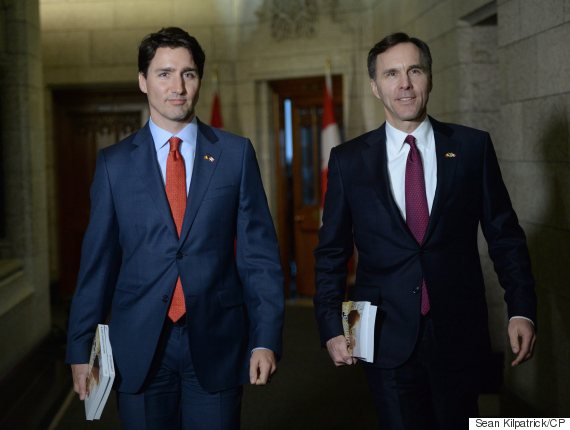 Minister of Finance Bill Morneau is accompanied by Prime Minister Justin Trudeau as he makes his way to deliver the federal budget in the House of Commons on Parliament Hill in Ottawa on Tuesday, March 22, 2016. THE CANADIAN PRESS/Sean Kilpatrick