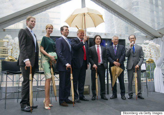 Real estate investor Donald Trump, center, stands for a photograph with Eric Trump, from left, Ivanka Trump, Donald Trump Jr., Joo Kim Tiah, chief executive officer of Holborn Group, and Vancouver City Council member Geoff Meggs during an event in Vancouver, British Columbia, Canada, on Wednesday, June 19, 2013. Trump said the $360-million Trump International Hotel and Tower in Vancouver, to be built be built by Holborn Group, will be an architectural wonder and worth the price. Photographer: Ben Nelms/Bloomberg via Getty Images