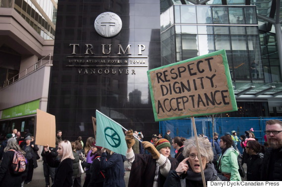 People march past the still under construction Trump International Hotel and Tower during a women's march and protest against U.S. President Donald Trump, in Vancouver, B.C., on Saturday January 21, 2017. Protests are being held across Canada today in support of the Women's March on Washington. Organizers say 30 events in all have been organized across Canada, including Ottawa, Toronto, Montreal and Vancouver. THE CANADIAN PRESS/Darryl Dyck