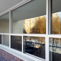 Phasing in Energy Efficiency: Why Your Multifamily Building Needs Fixed Over Slider Windows