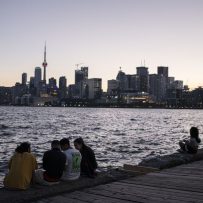 CANADA ADDS MOST NEW RESIDENTS IN YEARS AS RESTRICTIONS EASE
